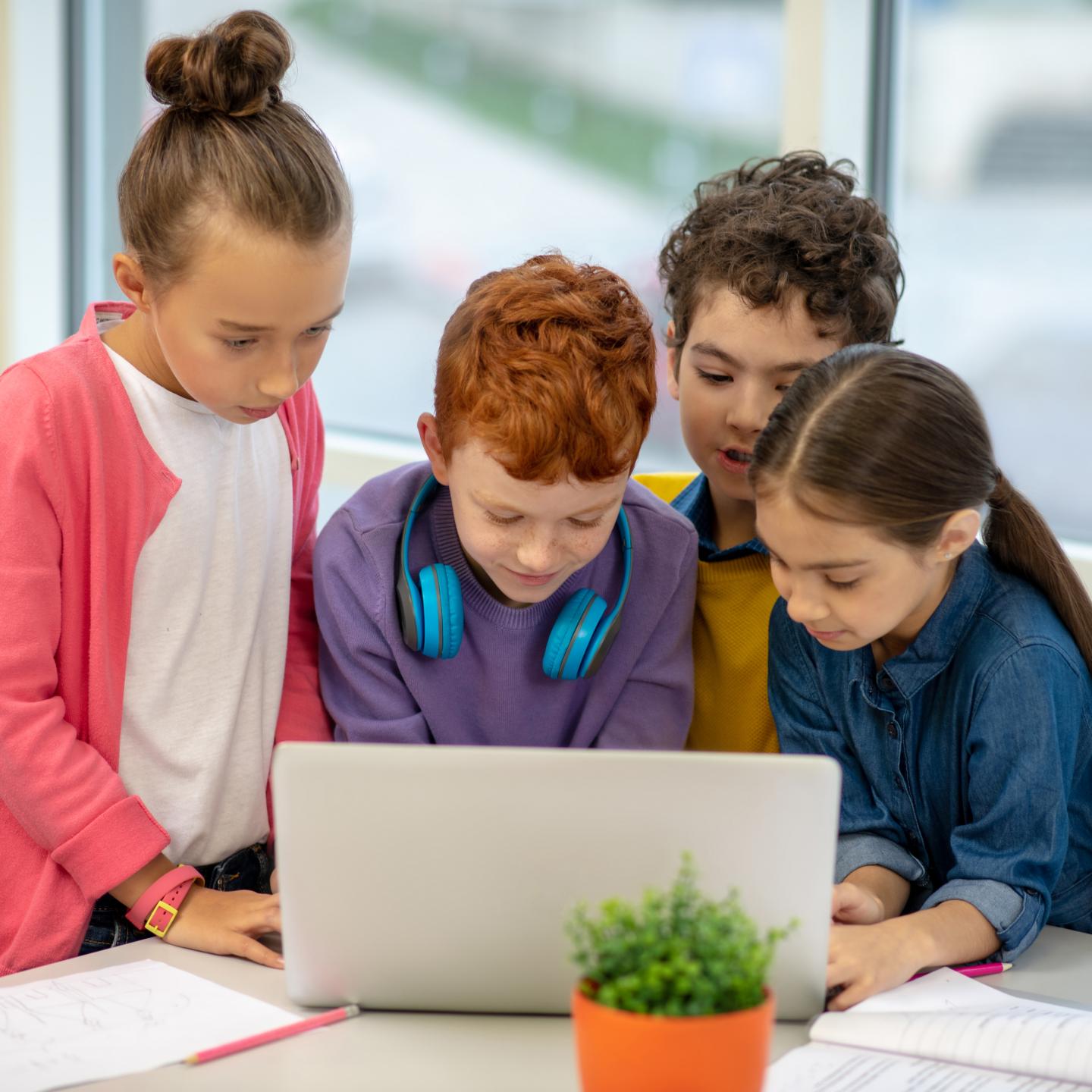 school-children-standing-together-front-laptop